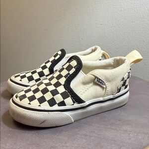 Vans toddler Asher V slip-on shoes in a black and white checkerboard pattern.